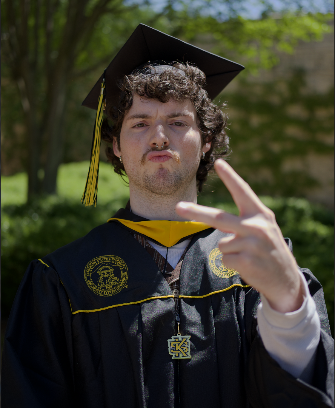 ian throwing a peace sign